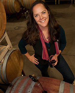 Garnet winemaker Alison Crowe with a red wine glass in the cellar